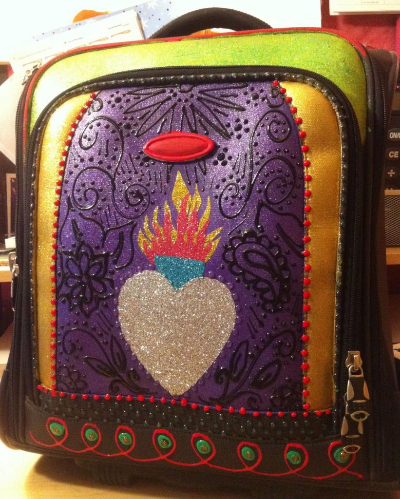 DIY glittered suitcase by Crafty Chica. #craftychica #glittercraft #paintedsuitcase