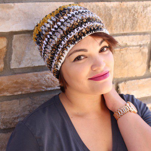 For this beanie, I used all black, white, gold and striped yarns. (Dania Zarate, model)