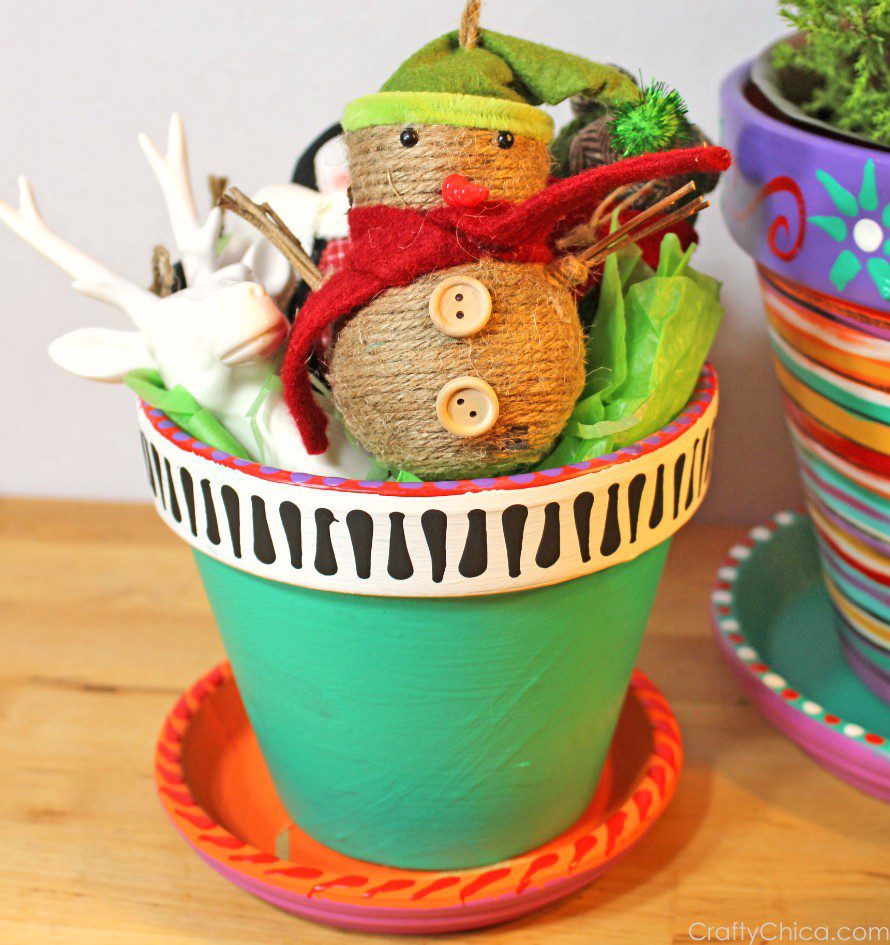 Painted flower pots by CraftyChica.com.