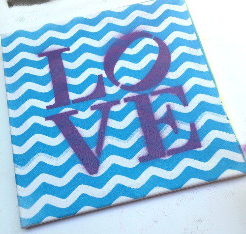 Spray Paint Canvas Art! Use lace, stencils and spray paint to make a colorful canvas! CraftyChica.com