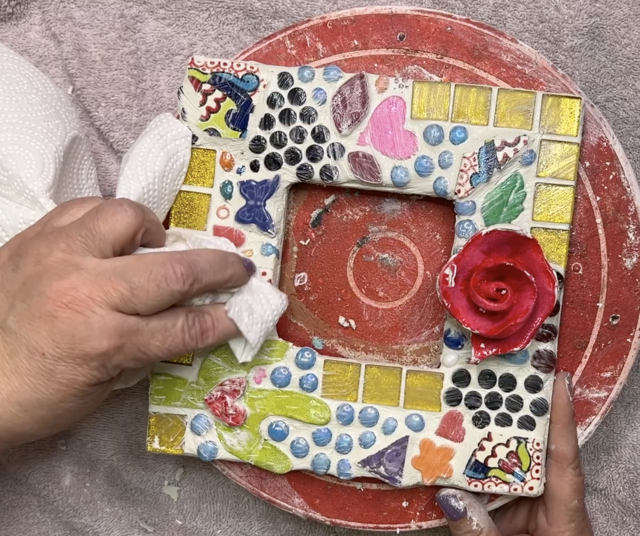 polishing tiles on amosaic frame