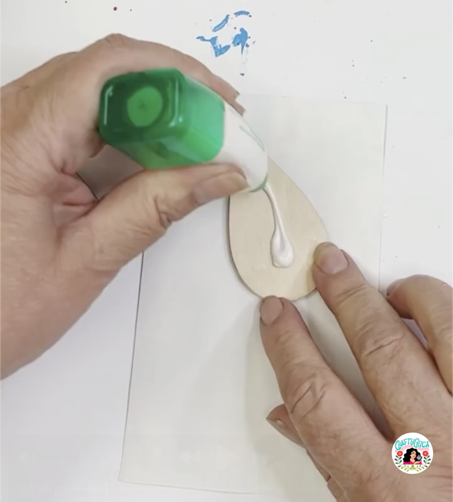 apply glue to DIY Loteria earrings