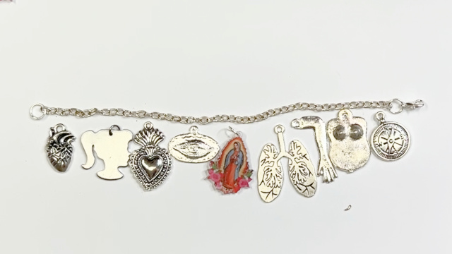 charm bracelet set on a table.